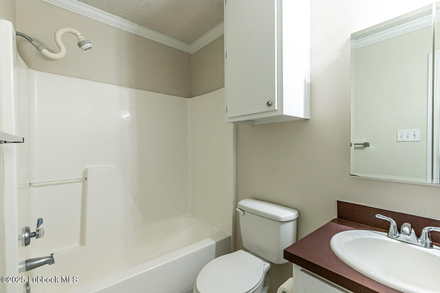 6120 7th Drive Lubbock, TX 79416 - Photo 20 of 33 a bathroom with a sink toilet and shower