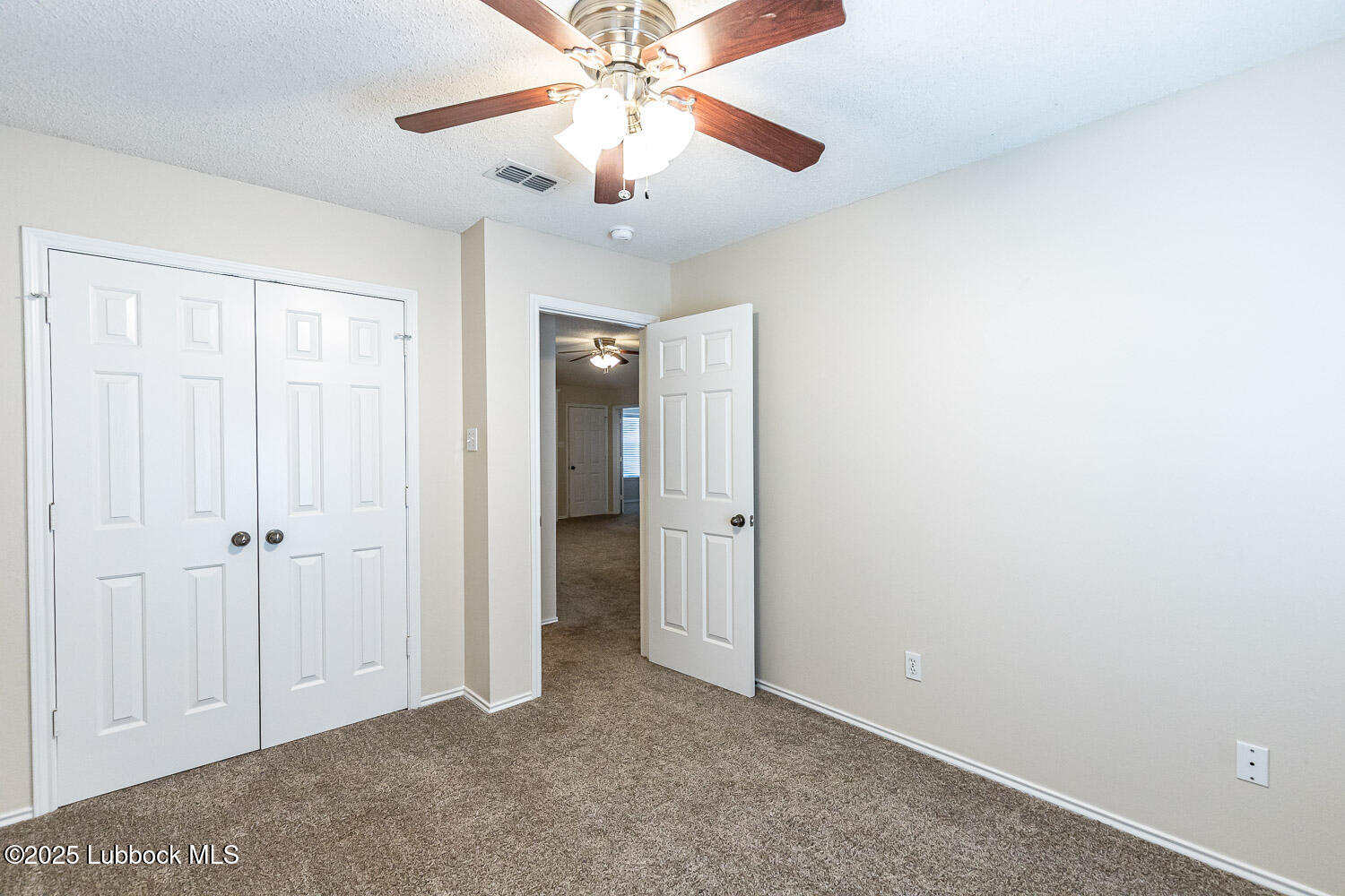 6120 7th Drive Lubbock, TX 79416 - Photo 24 of 33 a view of an empty room and chandelier fan