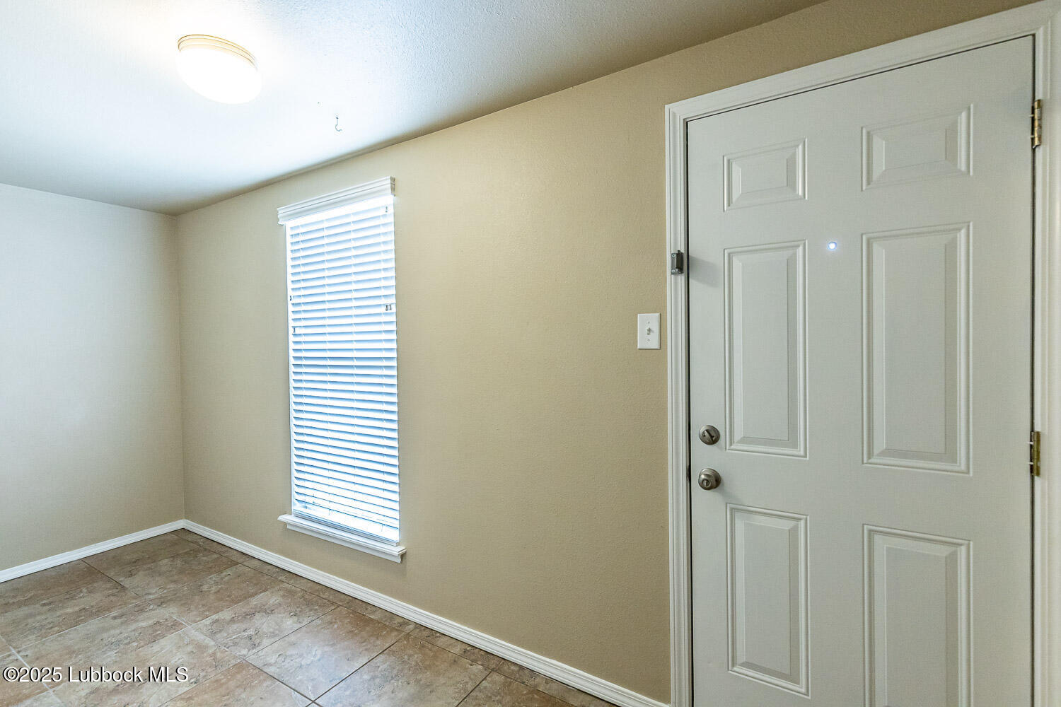 6120 7th Drive Lubbock, TX 79416 - Photo 26 of 33 a view of an empty room with a window