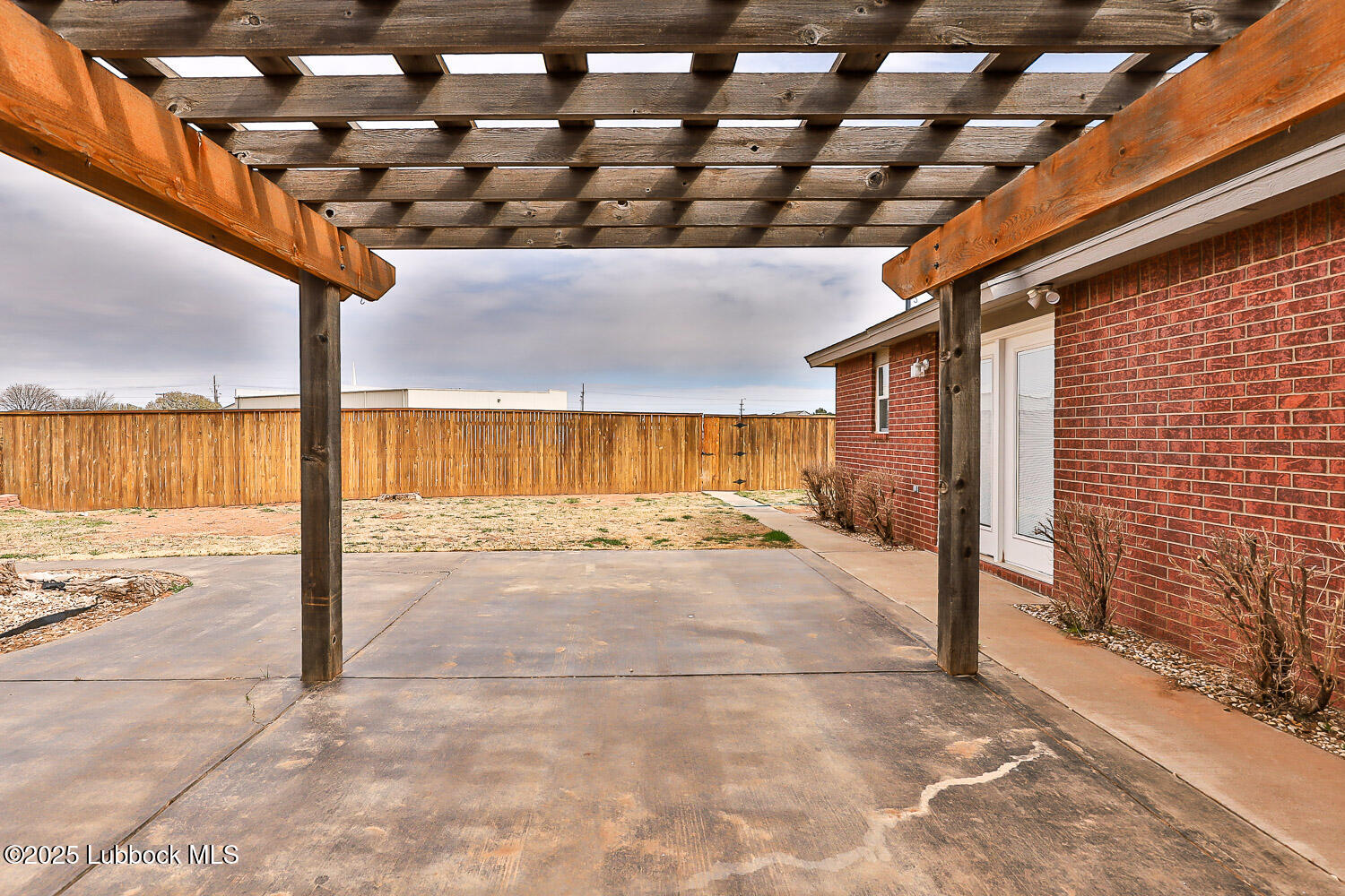6120 7th Drive Lubbock, TX 79416 - Photo 31 of 33 a view of a patio with wooden fence