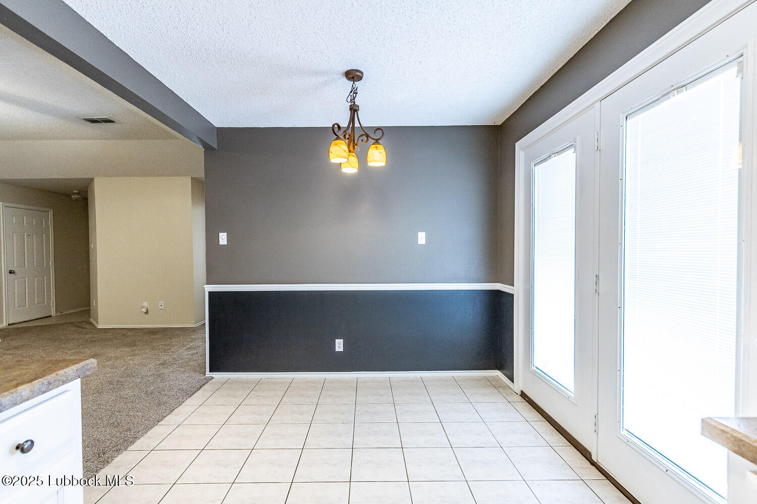 6120 7th Drive Lubbock, TX 79416 - Photo 10 of 33 a view of an empty room with window