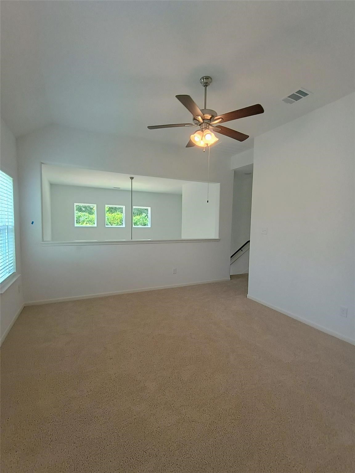 15924 Cy Young Court Splendora, TX 77372 - Photo 17 of 29 an empty room with windows and fan