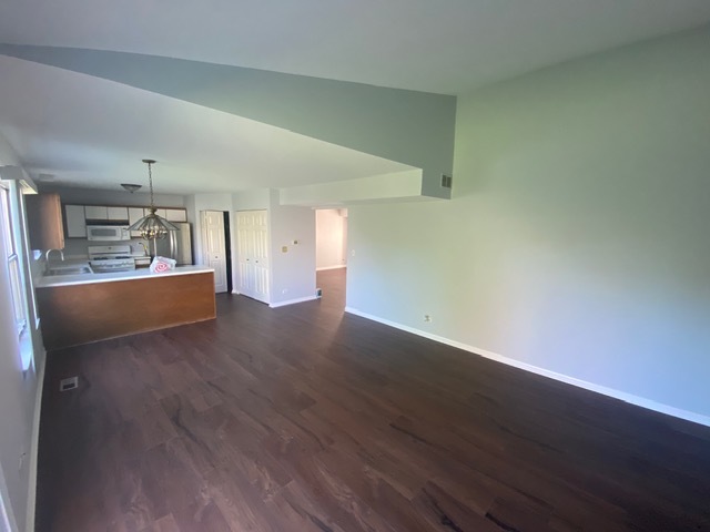209 North Southport Road Mundelein, IL 60060 - Photo 10 of 18 a view of a kitchen with wooden floor and a sink