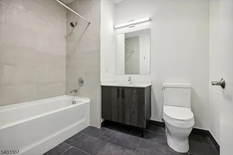a bathroom with a toilet a sink and bathtub