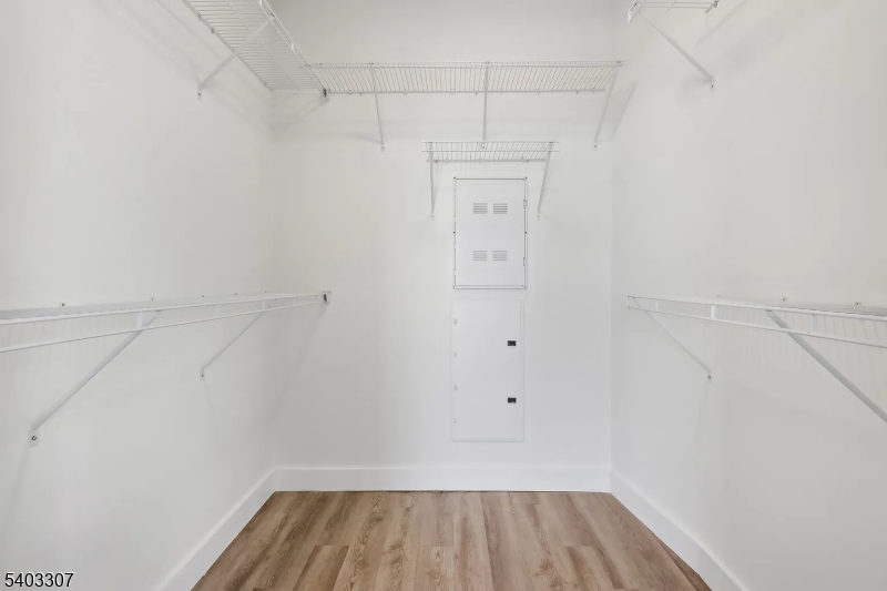 49 South Day Street, Unit 316 Orange, NJ 07050 - Photo 14 of 26 a view of a room with racks on the wall