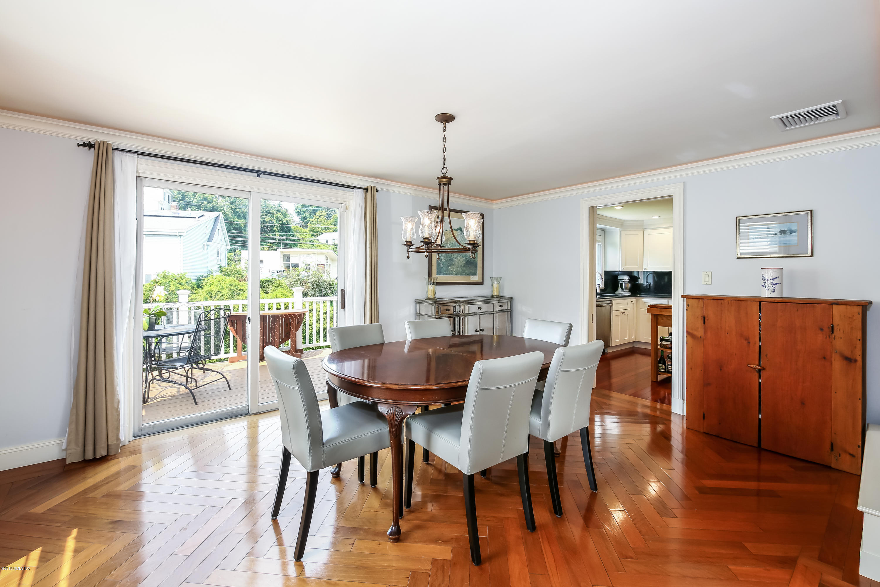 52 Ute Place, Unit A Greenwich, CT 06830 - Photo 11 of 32 a view of a dining room with furniture window and wooden floor