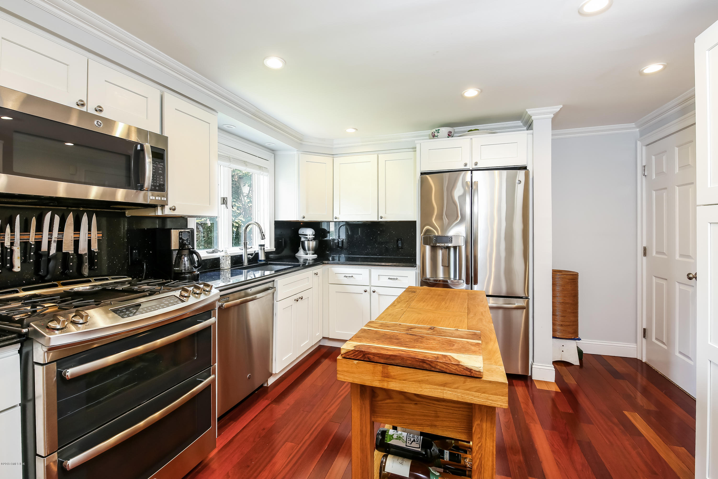 52 Ute Place, Unit A Greenwich, CT 06830 - Photo 12 of 32 a kitchen with stainless steel appliances a refrigerator stove and oven