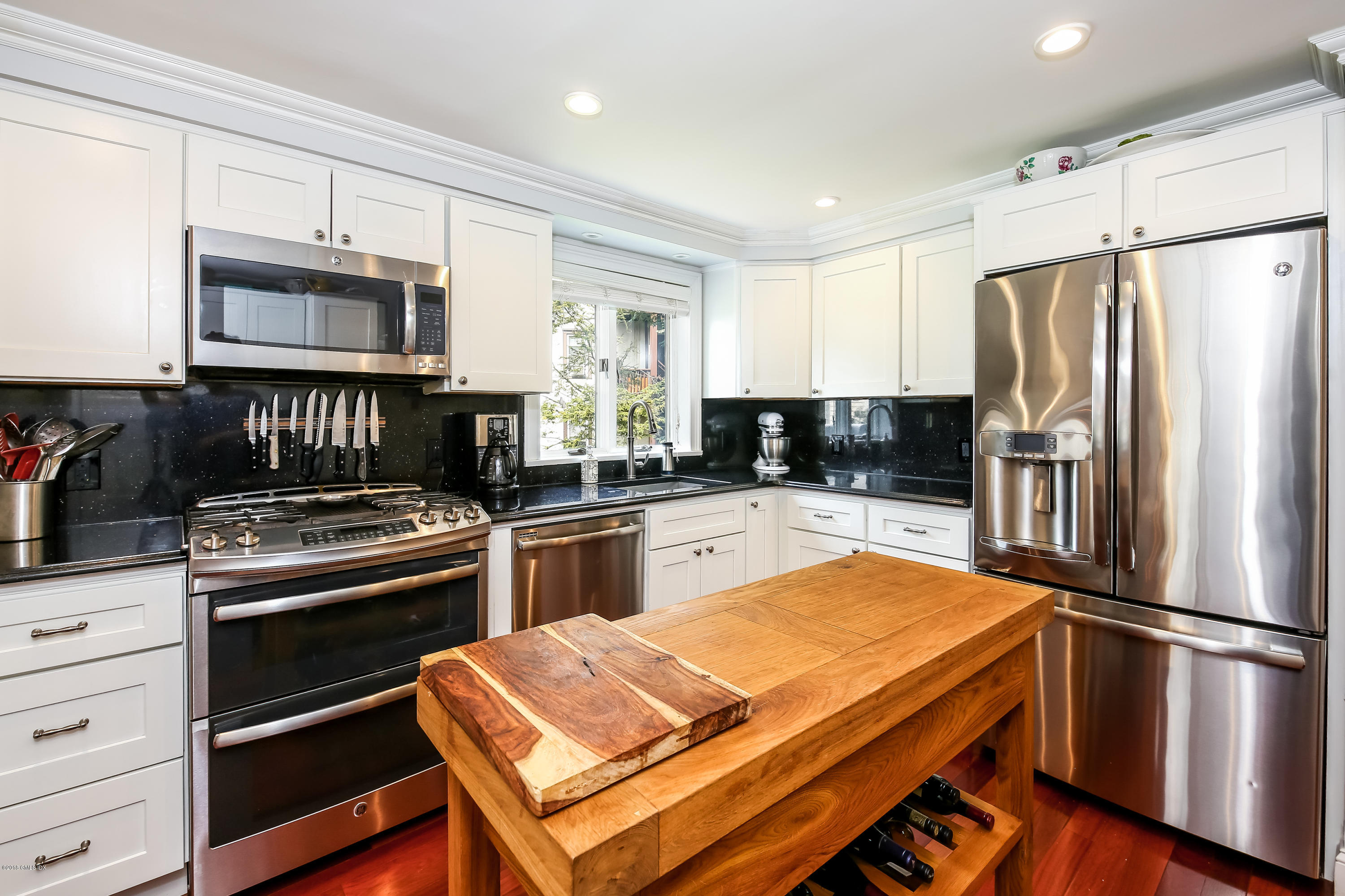 52 Ute Place, Unit A Greenwich, CT 06830 - Photo 13 of 32 a kitchen with a refrigerator stove and sink
