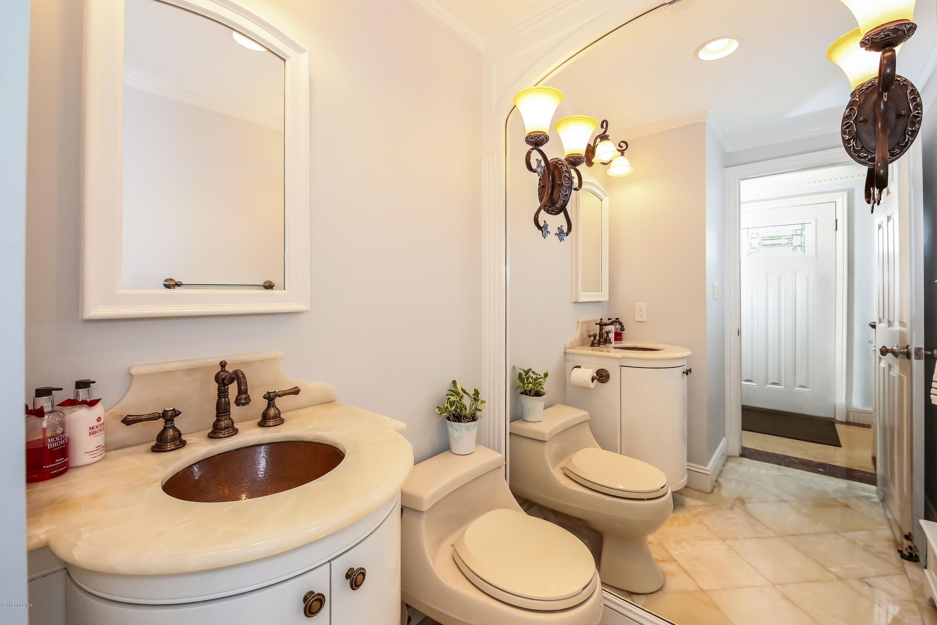 52 Ute Place, Unit A Greenwich, CT 06830 - Photo 15 of 32 a bathroom with a toilet sink and mirror