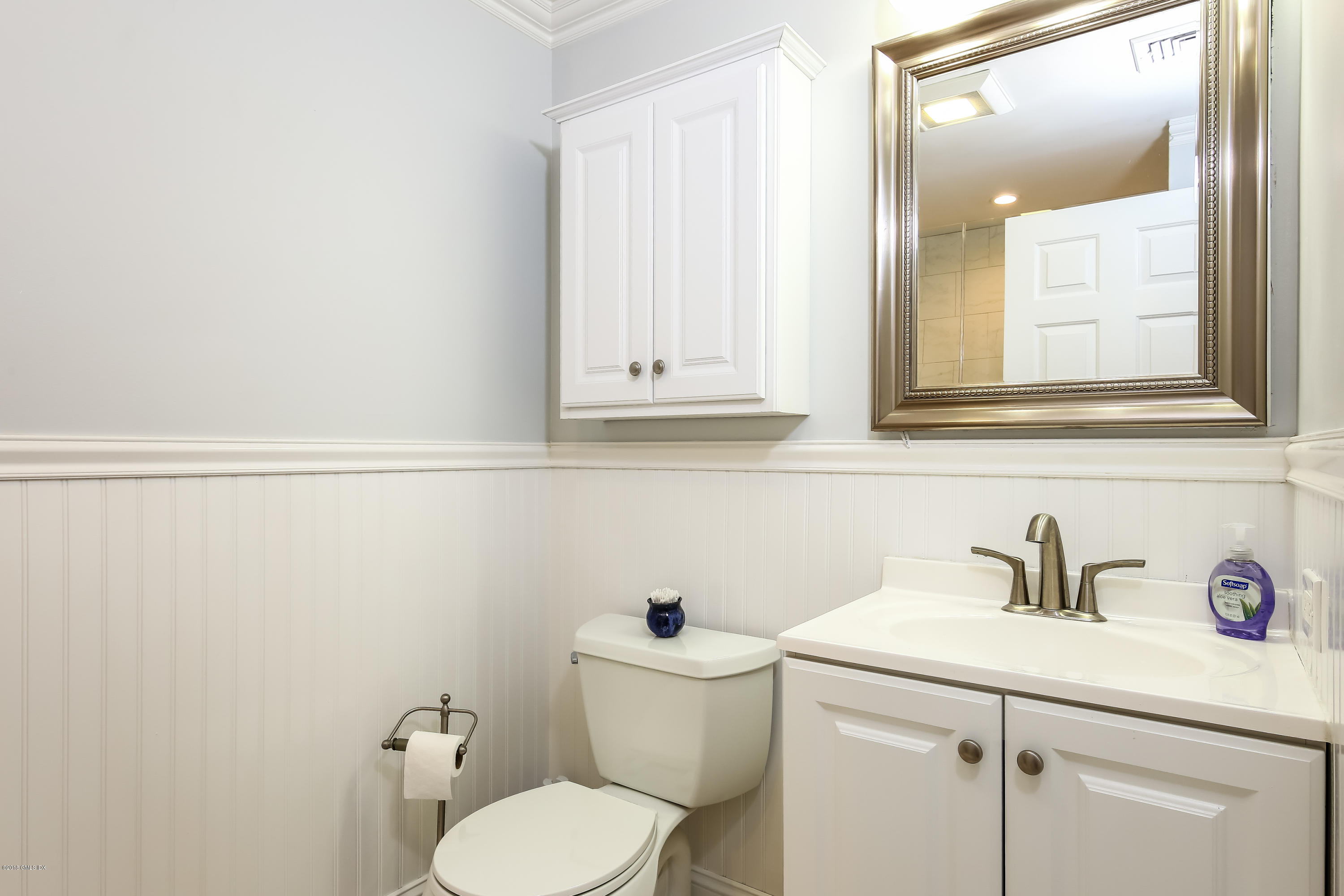 52 Ute Place, Unit A Greenwich, CT 06830 - Photo 18 of 32 a bathroom with a toilet sink and mirror