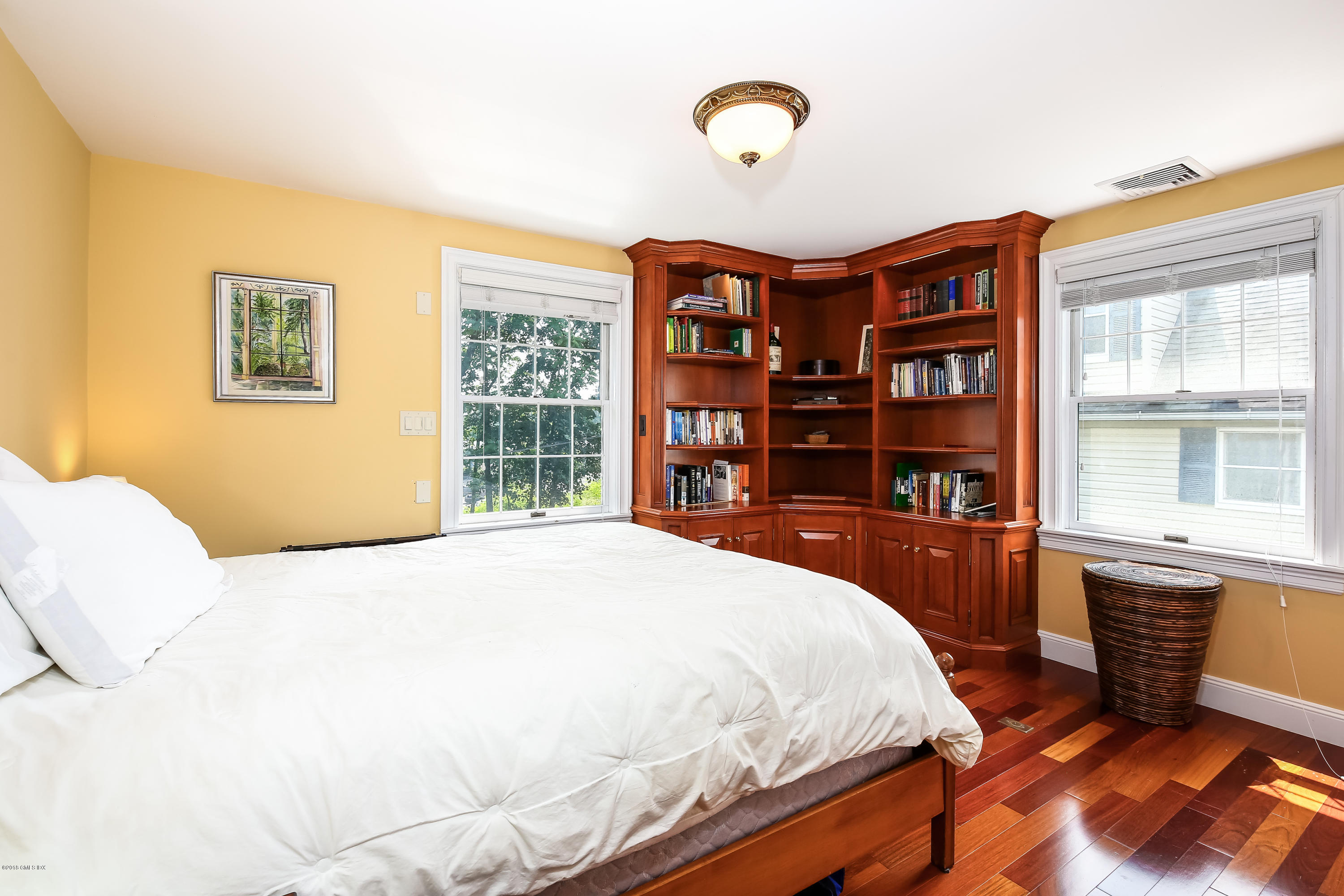 52 Ute Place, Unit A Greenwich, CT 06830 - Photo 20 of 32 a spacious bedroom with a bed and a cabinets