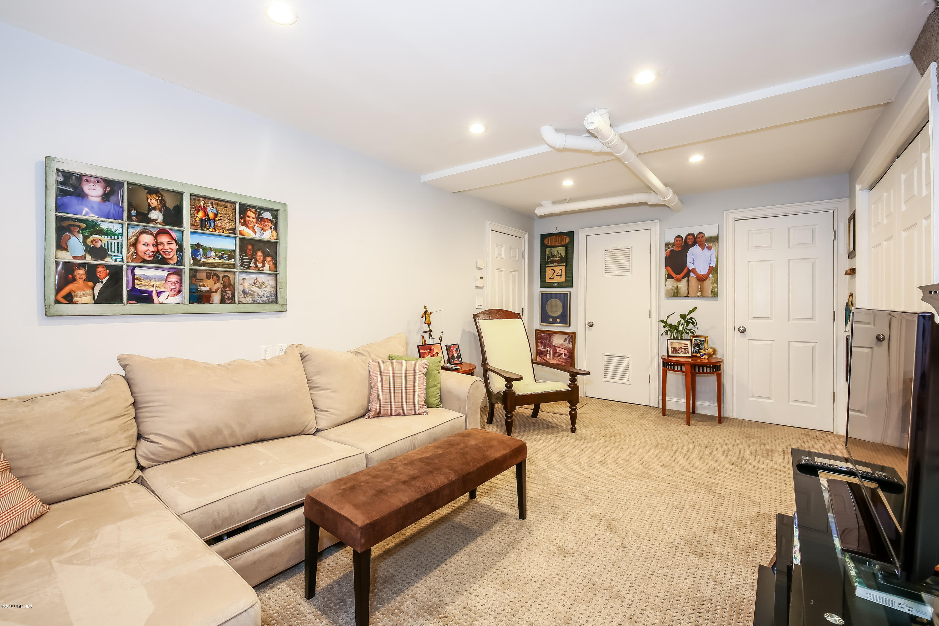 52 Ute Place, Unit A Greenwich, CT 06830 - Photo 25 of 32 a living room with furniture and a flat screen tv
