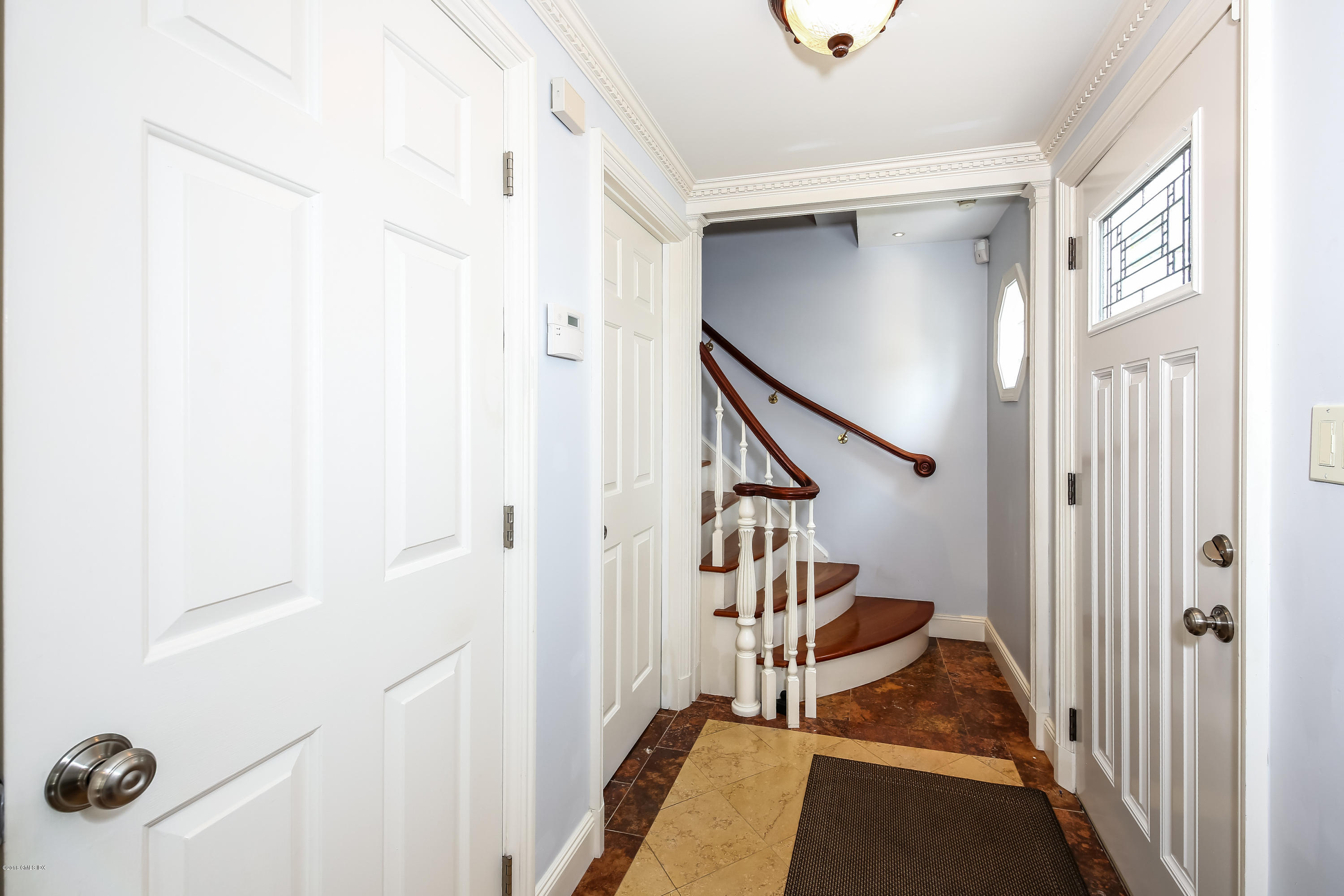 52 Ute Place, Unit A Greenwich, CT 06830 - Photo 5 of 32 a view of a livingroom with stairs and furniture
