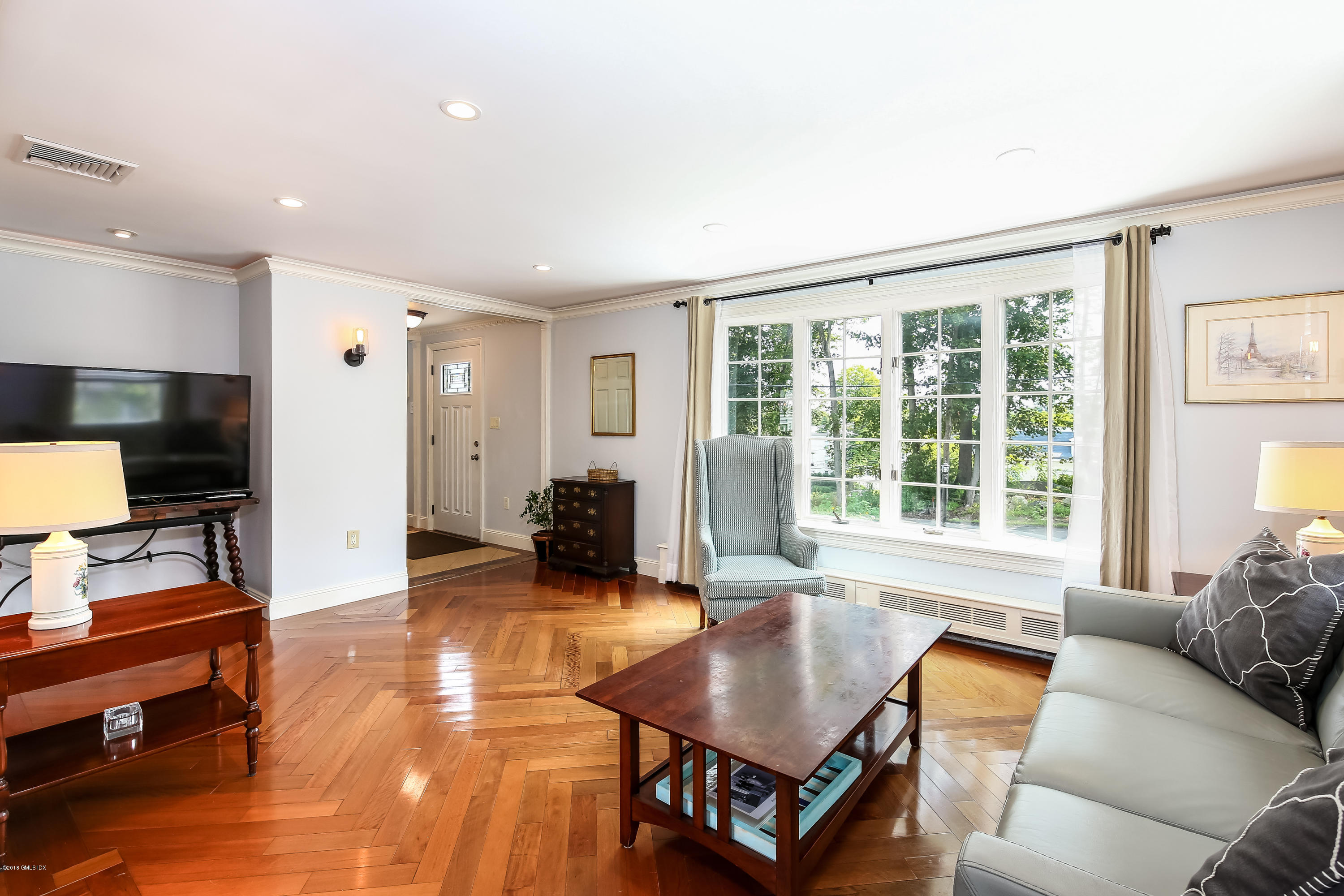 52 Ute Place, Unit A Greenwich, CT 06830 - Photo 8 of 32 a living room with furniture and a flat screen tv