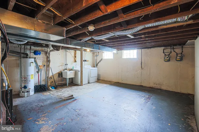 a front view of residential houses with yard and green space