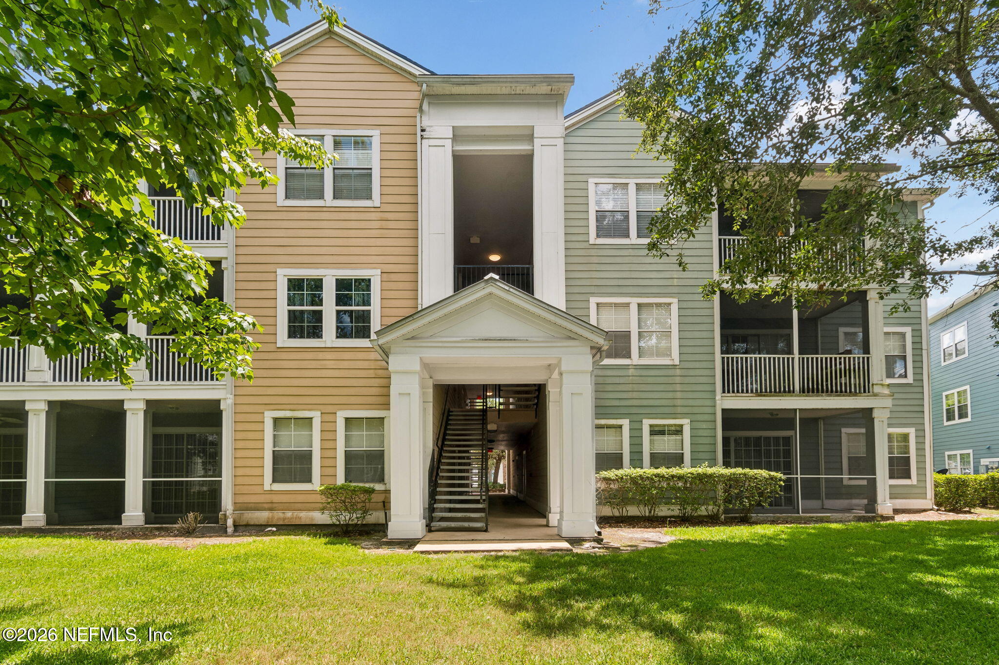8550 Touchton Road, Unit 511 Jacksonville, FL 32216 - Photo 17 of 63 front view of a brick house with a yard