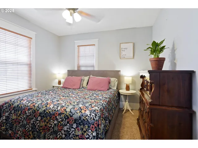 a bedroom with a bed and window