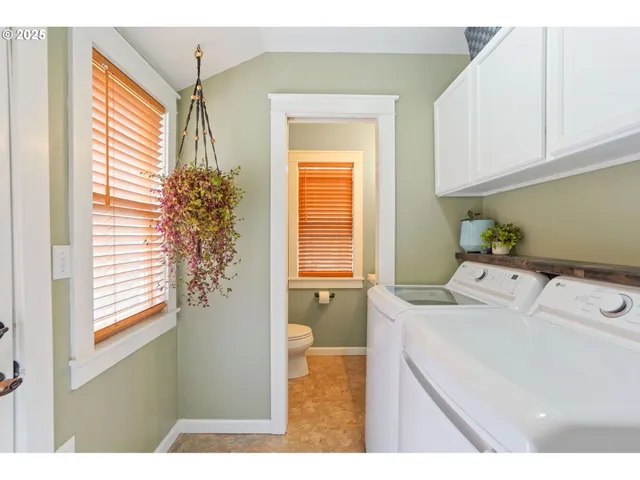 a bedroom with a bed and a dresser in it