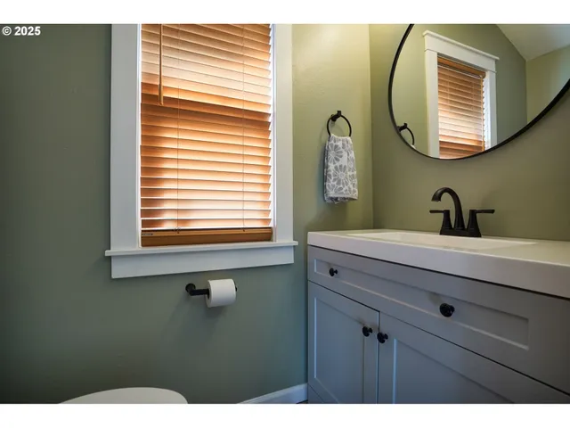 a view of a livingroom with furniture and workspace