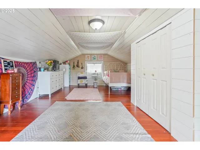 an outdoor sitting area with furniture and garden view