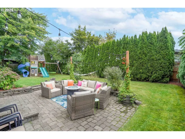 a backyard of a house with outdoor seating