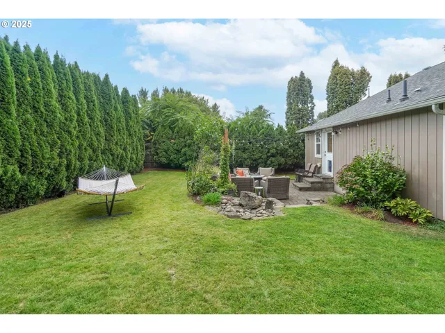 a swimming pool with some trees in the background