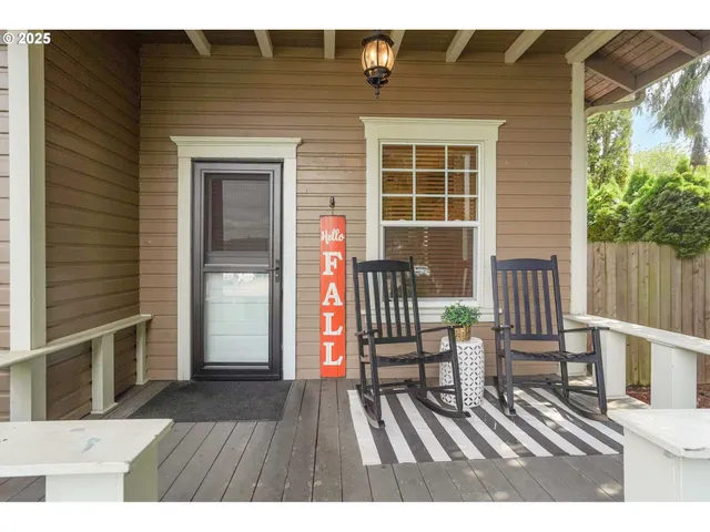a balcony with table and chairs