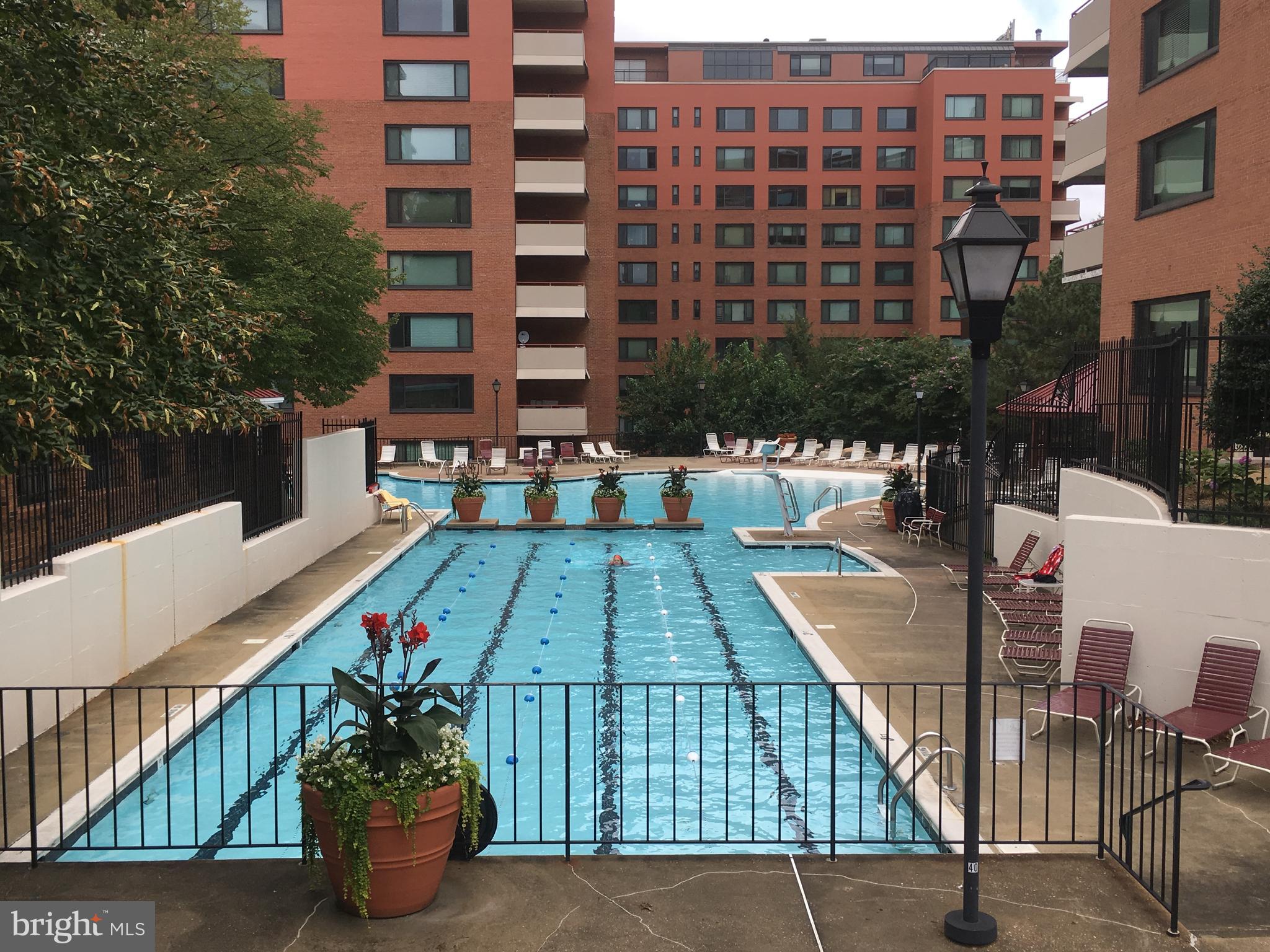 1021 Arlington Boulevard, Unit 610 Arlington, VA 22209 - Photo 14 of 17 a view of a patio with couches table and chairs and potted plants