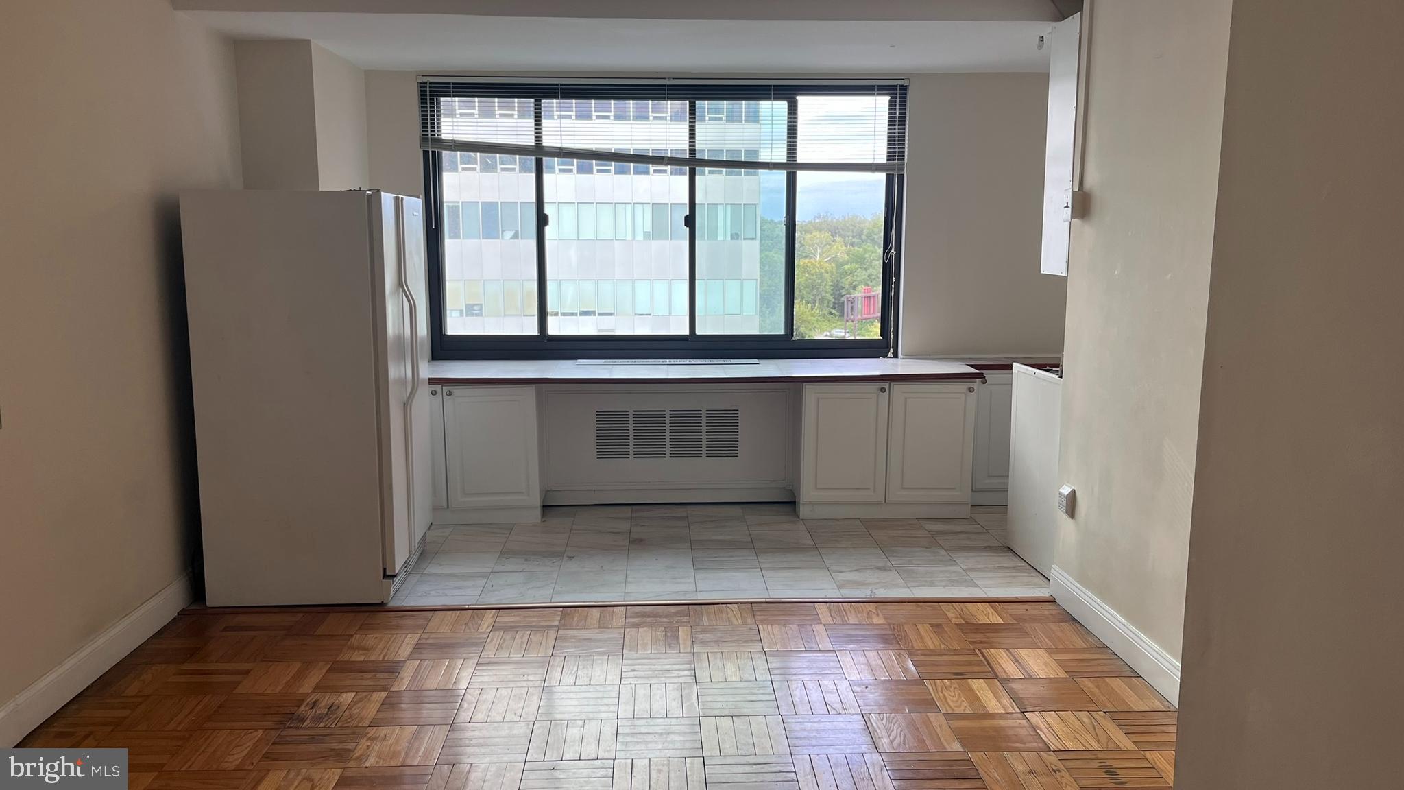 1021 Arlington Boulevard, Unit 610 Arlington, VA 22209 - Photo 2 of 17 a view of a kitchen with a sink and a window