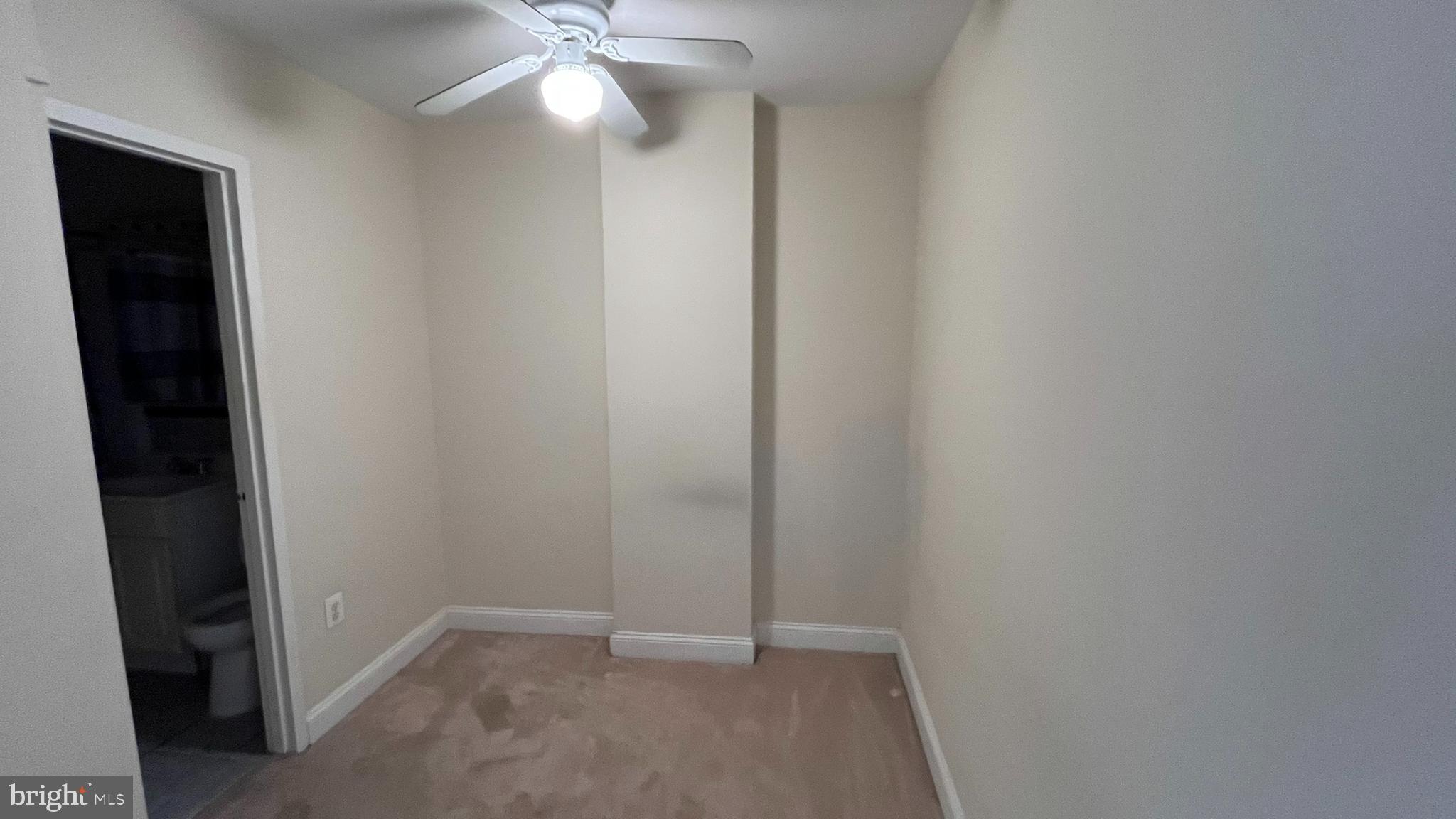 1021 Arlington Boulevard, Unit 610 Arlington, VA 22209 - Photo 6 of 17 an empty room with closet and a fan