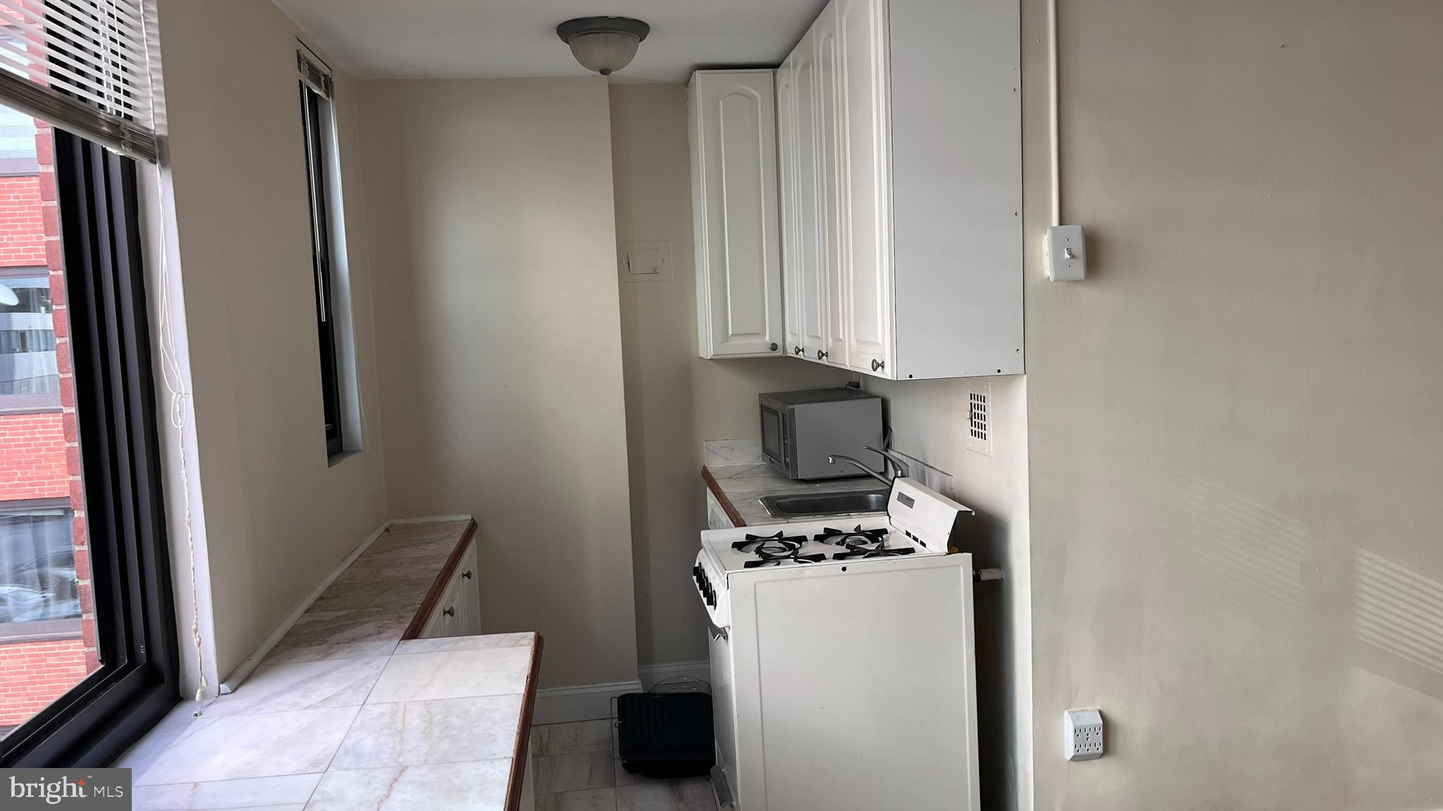 1021 Arlington Boulevard, Unit 610 Arlington, VA 22209 - Photo 8 of 17 a view of a storage and utility room with washer and dryer
