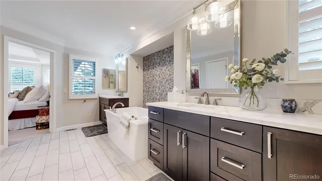 a spacious bathroom with a granite countertop sink mirror and a