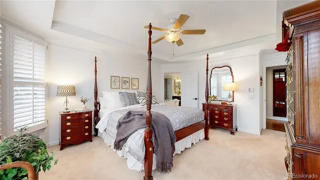 a spacious bedroom with a bed dresser and a window