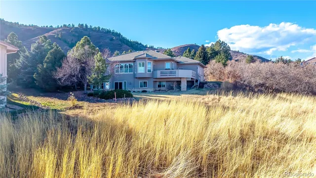 a view of swimming pool with a garden and plants