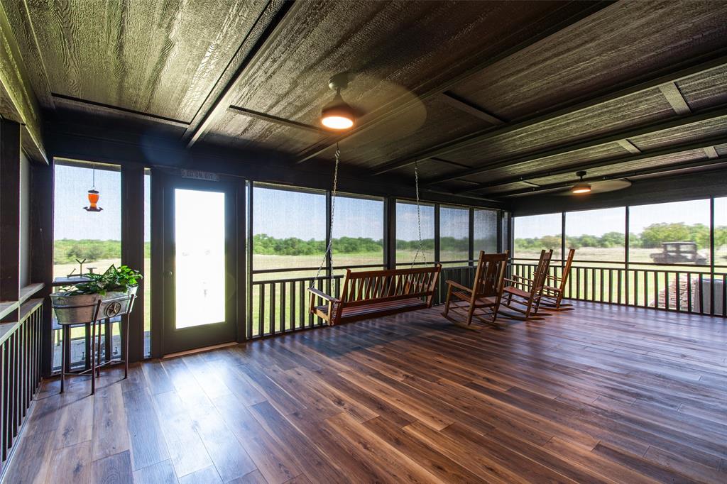 2043 Huddleston Road Sunset, TX 76270 - Photo 20 of 36 a view of a deck with wooden floor and outdoor space
