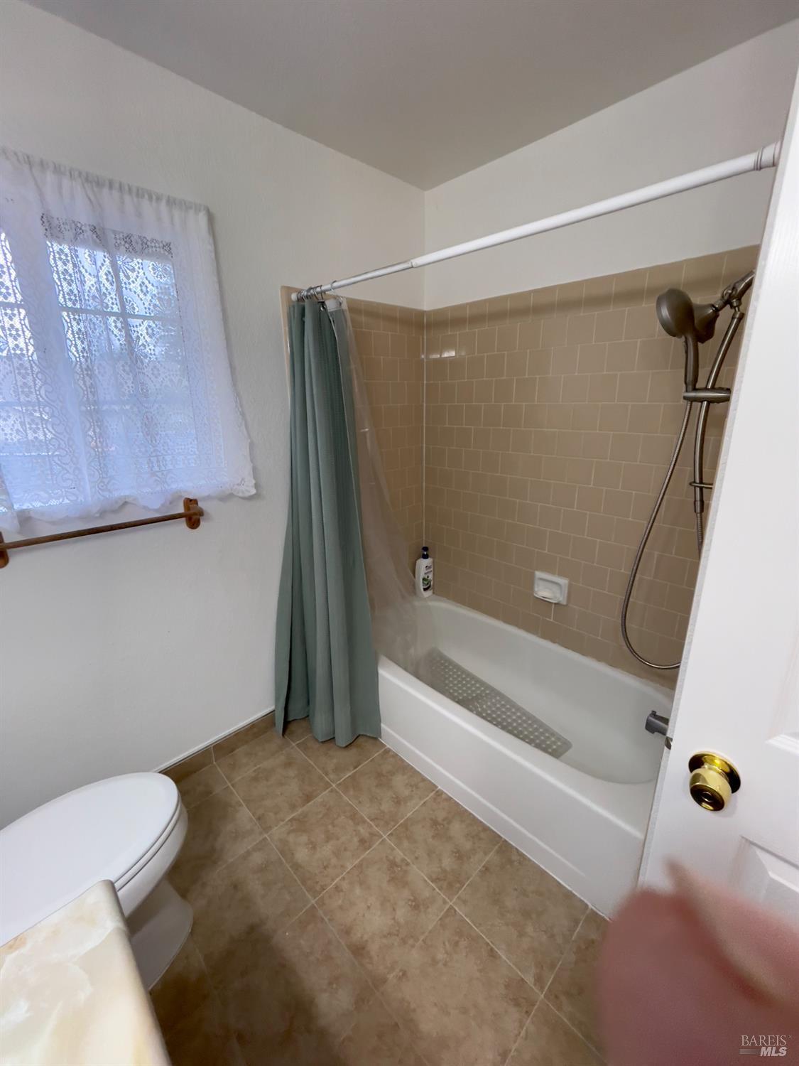 6191 San Carlos Court Rohnert Park, CA 94928 - Photo 13 of 37 a bathroom with a toilet and a bathtub