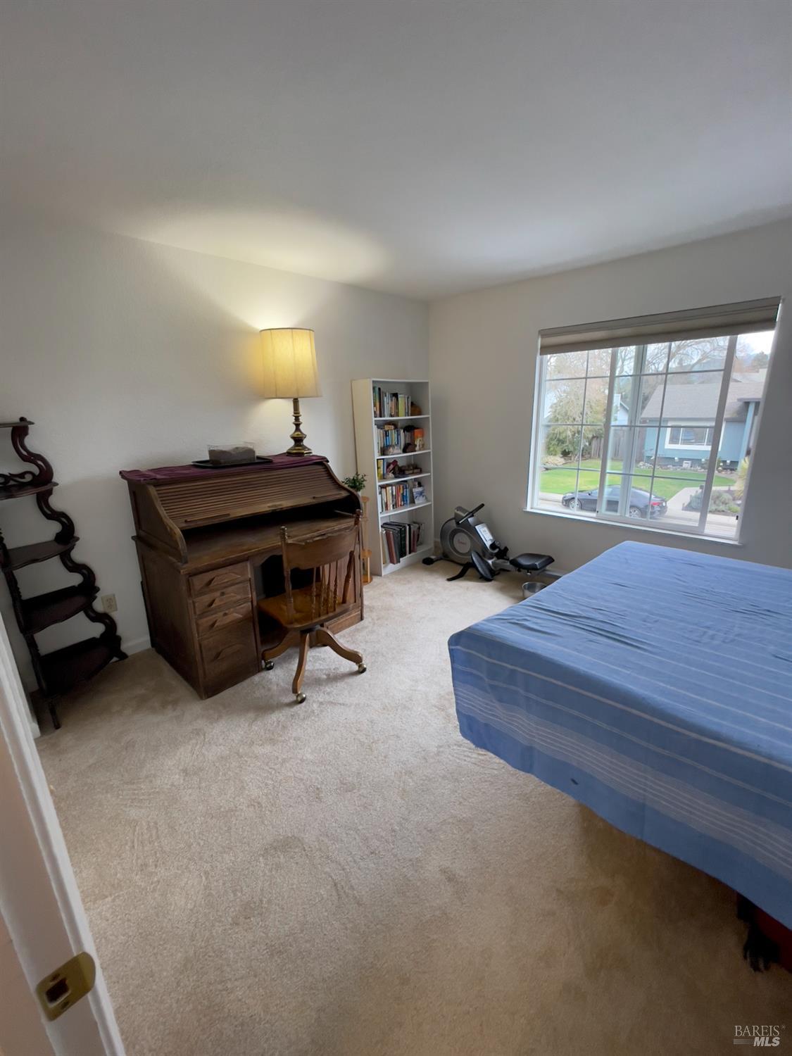 6191 San Carlos Court Rohnert Park, CA 94928 - Photo 15 of 37 a bedroom with a bed and a dresser next to a window