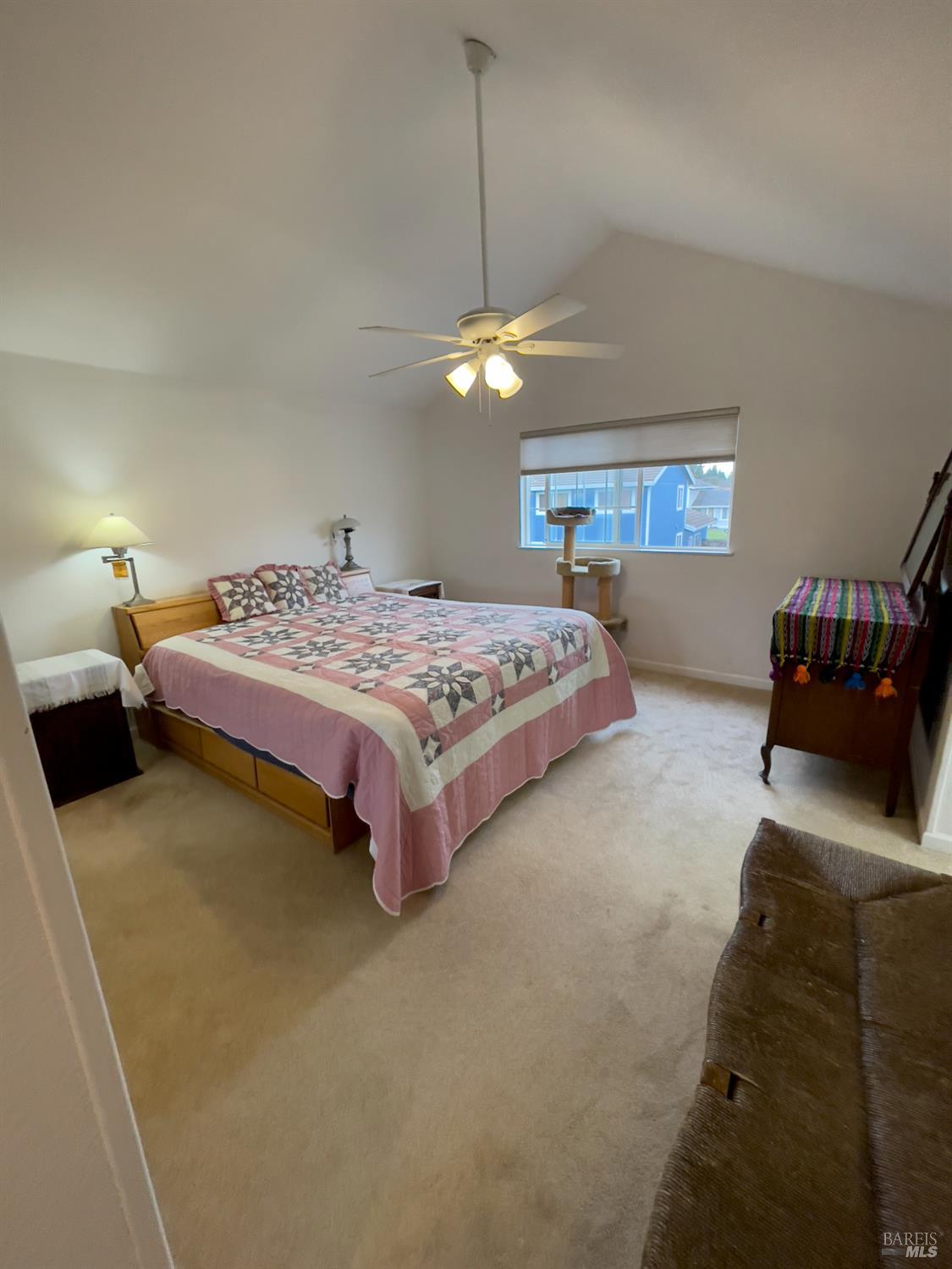 6191 San Carlos Court Rohnert Park, CA 94928 - Photo 27 of 37 a spacious bedroom with a bed and a chandelier