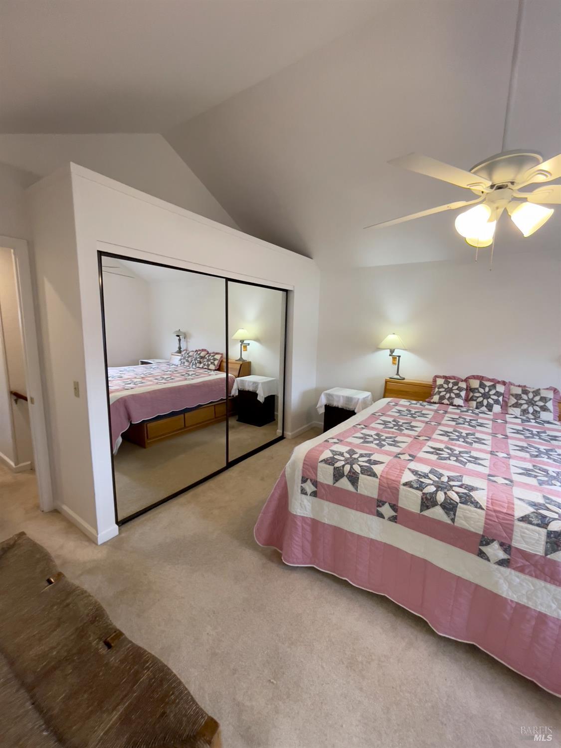 6191 San Carlos Court Rohnert Park, CA 94928 - Photo 29 of 37 a bedroom with a bed and a chandelier