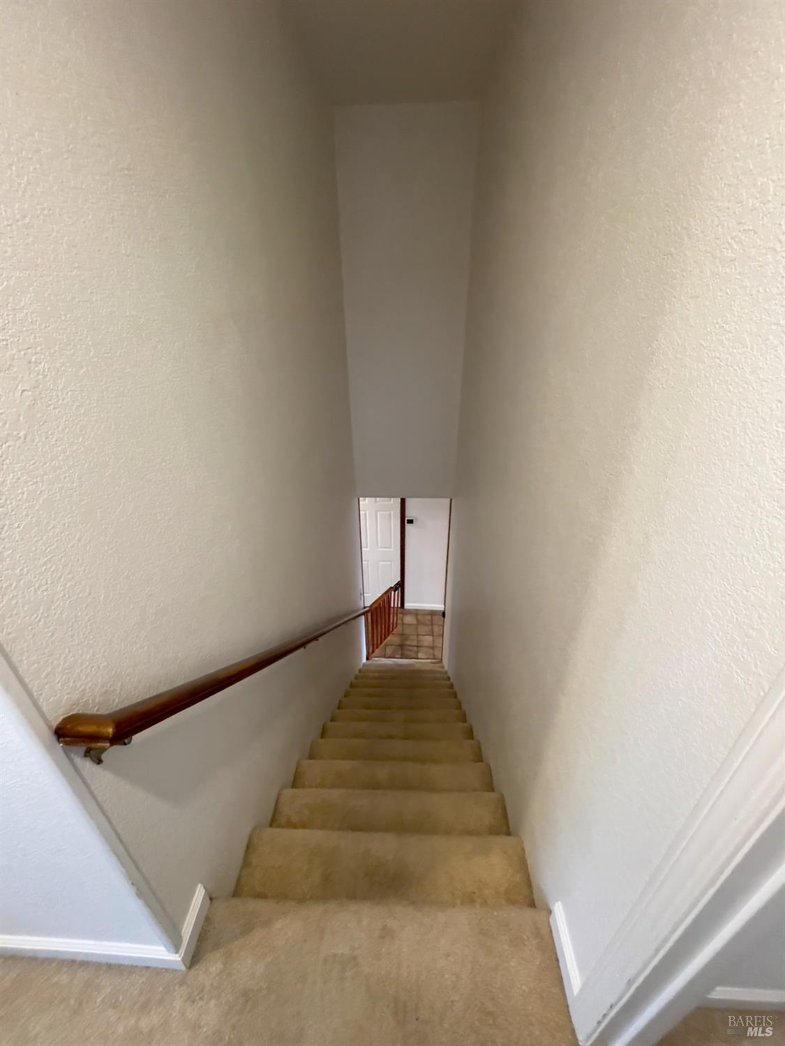 6191 San Carlos Court Rohnert Park, CA 94928 - Photo 31 of 37 a view of a hallway with wooden staircase