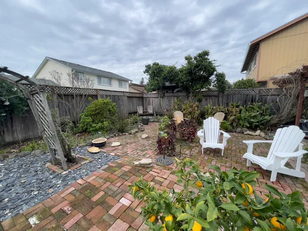 a row of table and chairs in the patio