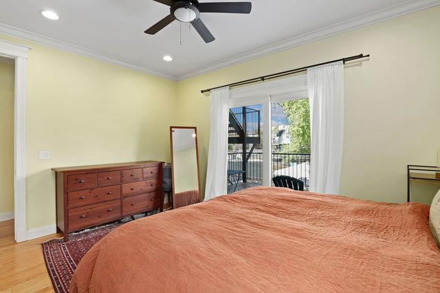 a bedroom with a bed and a dresser