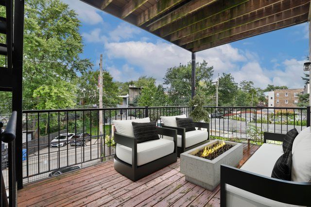 a view of a balcony with wooden floor
