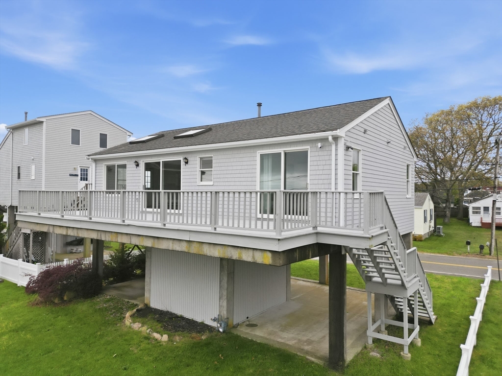192 Swifts Beach Road Wareham, MA 02571 - Photo 10 of 38 a balcony with furniture and a window