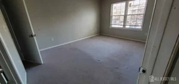 an empty room and window