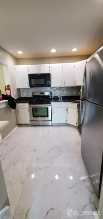 a view of kitchen with a sink