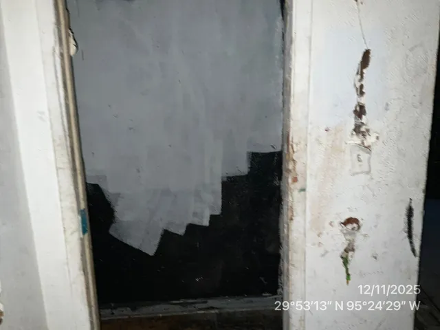 an empty room with wooden floor