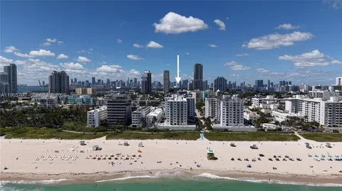 a view of a lake with a building in the background