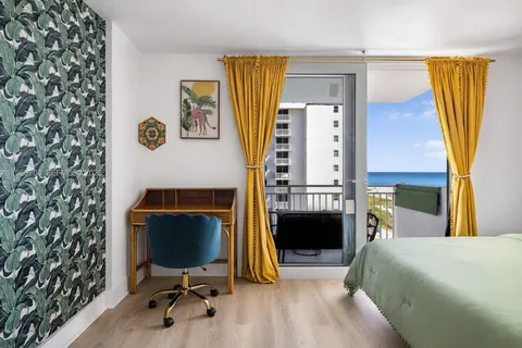 a bed room with a bed and a chair