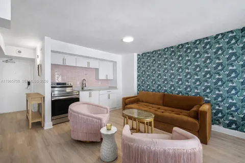 a living room with furniture and a rug